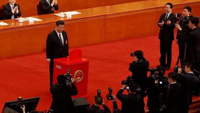 File Photo of Chinese President Xi Jinping casting his ballot during a vote on a constitutional amendment lifting presidential term limits, at the third plenary session of the National People's Congress (NPC) at the Great Hall of the People in Beijing, China 11 March, 2018 | Reuters