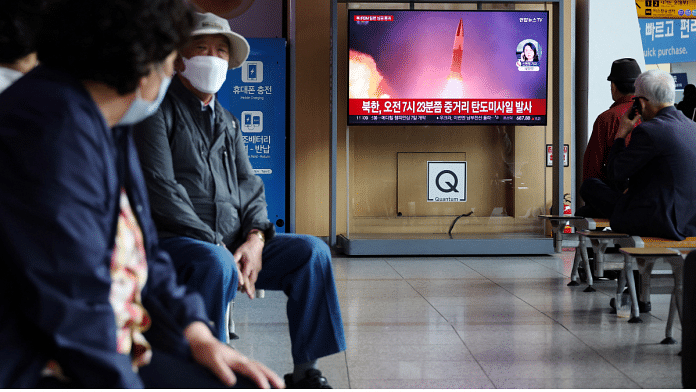 People watch a TV broadcasting a news report on North Korea firing a ballistic missile over Japan | Reuters/Kim Hong-Ji