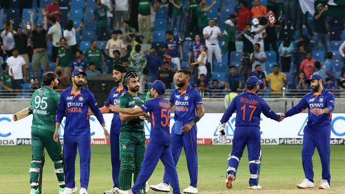 Players shake hands after a match in Dubai | Reuters/Satish Kumar