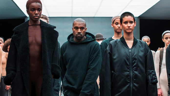 Singer Kanye West walks past models after presenting his Fall/Winter 2015 partnership line with Adidas at New York Fashion Week February 12, 2015. REUTERS/Lucas Jackson/File Photo