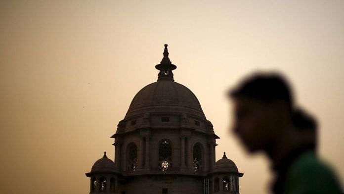 File photo of A commuter walks past the building of India's Ministry of Finance during dusk in New Delhi, India, 18 May, 2015.| Reuters