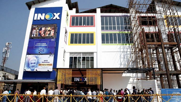 File photo of members of media and Jammu and Kashmir government officials wait to enter a multi-screen cinema hall run by India's leading multiplex chain Inox before its inauguration in Srinagar 20 September, 2022 | Reuters