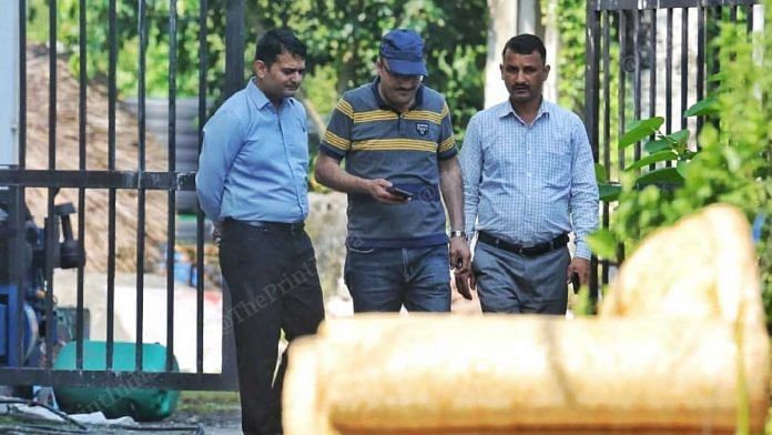 Officers of Local intelligence Unit (LIU) come out of the demolished Vanantra Resort after inspection | Praveen Jain | ThePrint