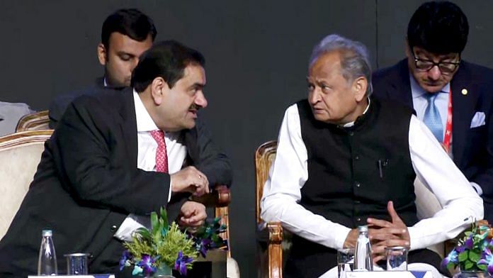 Rajasthan Chief Minister Ashok Gehlot interacts with Adani Group Chairman Gautam Adani at the Invest Rajasthan Summit 2022 Friday | ANI