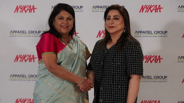 Falguni Nayar, Nykaa's founder & CEO, and Sima Ganwani Ved, Apparel Group's founder & chairwoman, pose for a picture during a strategic alliance announcement in Mumbai, on 6 October 2022 | Reuters