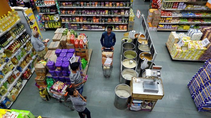 Customers buy grocery at a food superstore in Ahmedabad | Reuters file photo