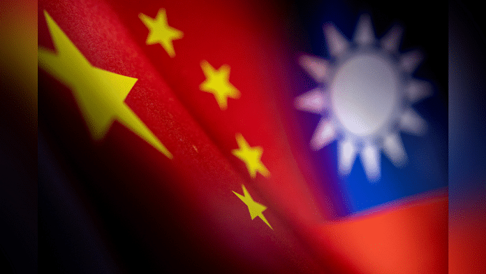 Chinese and Taiwanese printed flags are seen in this illustration | Reuters File Photo/Dado Ruvic/Illustration