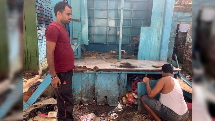 Tinku and Amaranth Prasad at their ransacked paan shop in Ekbalpore Monday | ThePrint / Sreyashi Dey