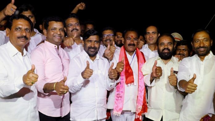 TRS candidate Koosukuntla Prabhakar Reddy (in pink shawl) and party leaders after winning the bypoll in Munugode Sunday | ANI