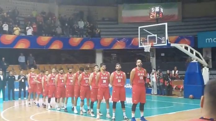 Screengrab of the video showing Iran’s national basketball team refusing to sing as the anthem plays in the background | Twitter / @FridaGhitis