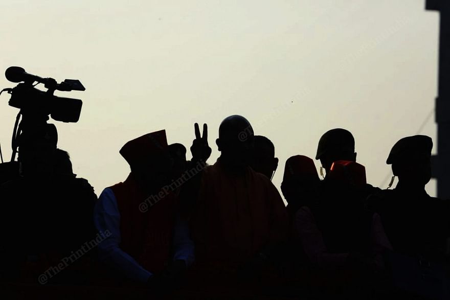Uttar Pradesh Chief Minister Yogi Adityanath flashes the victory sign while campaigning in Godhra Tuesday | Photo: Praveen Jain | ThePrint