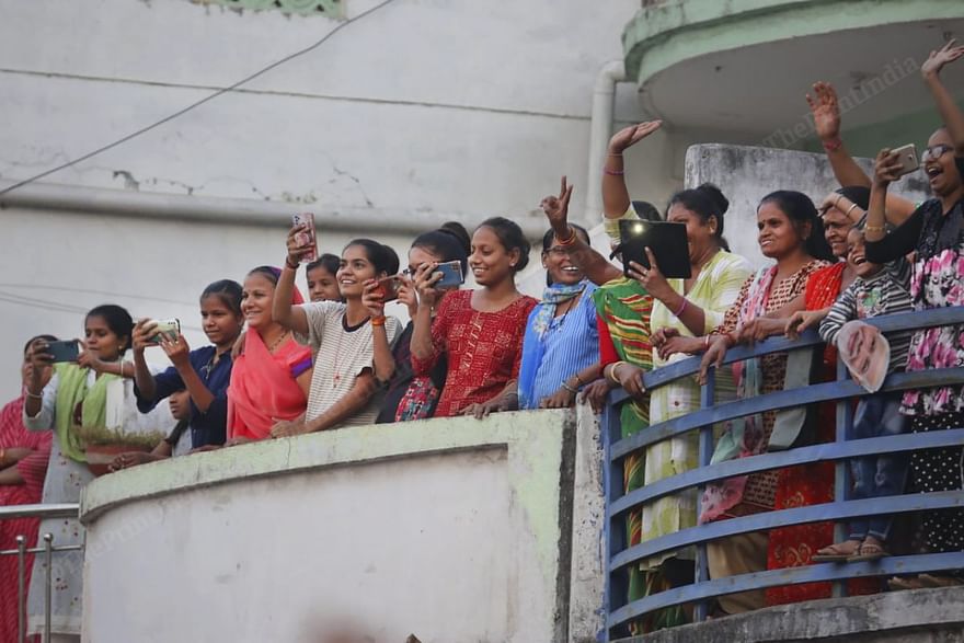 A group of women cheer and take photos of Shah | Photo: Praveen Jain | ThePrint
