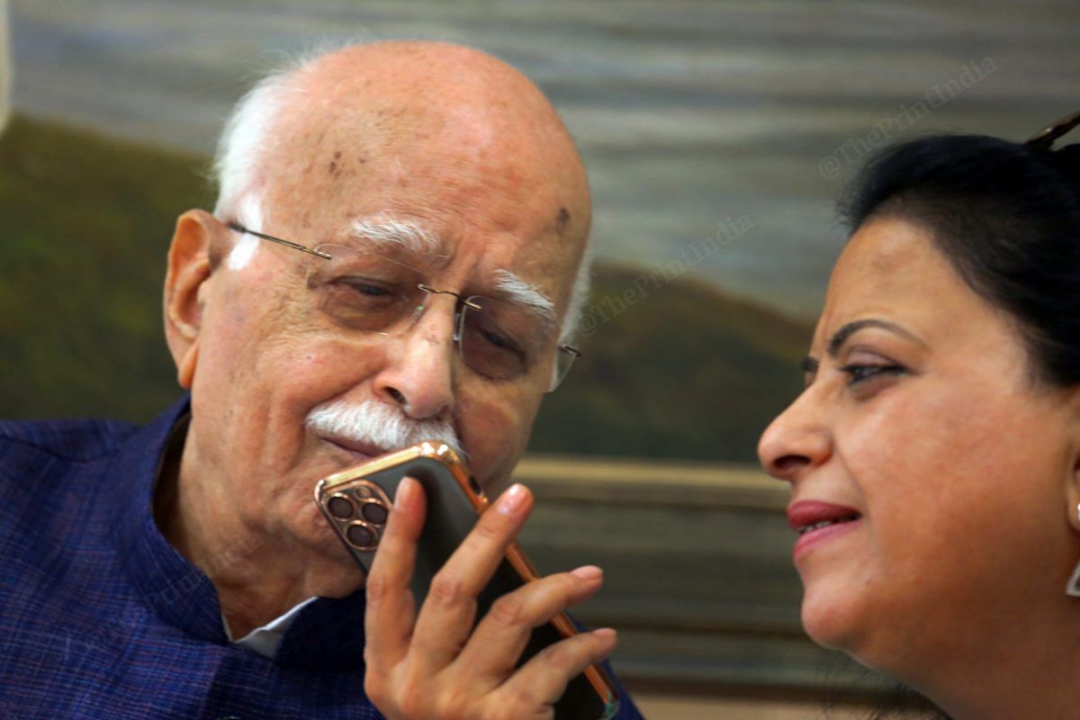 L.K. Advani’s daughter Pratibha Advani helps him attend to birthday wishes | Photo: Praveen Jain | ThePrint
