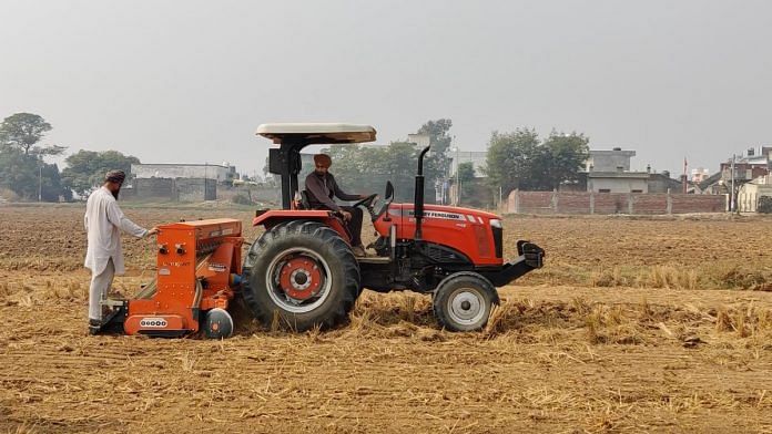 Farmers clearing field after harvest in Bajra | Disha Verma | ThePrint