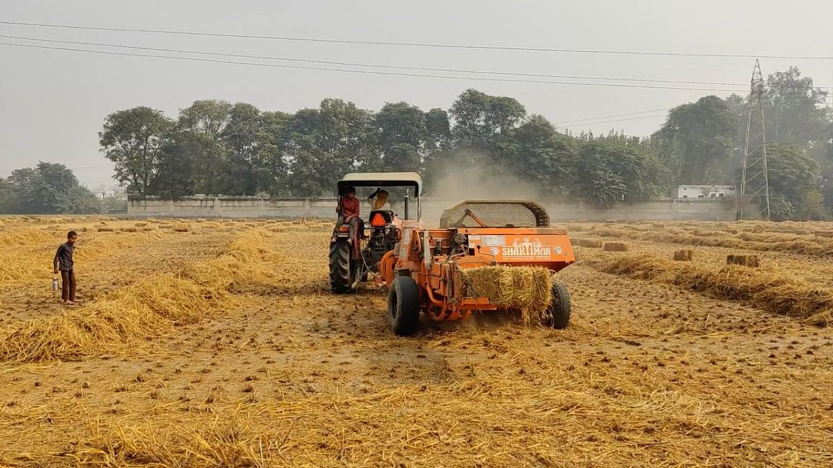 Baler machine at work in Bajra | Disha Verma | ThePrint