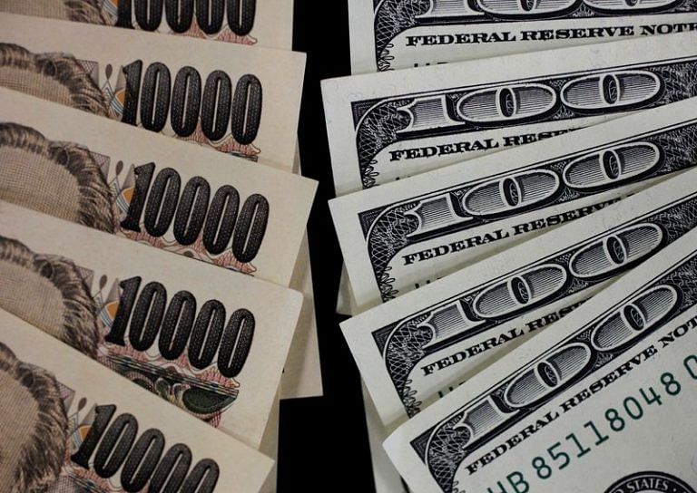 Dollar eases on improved risk sentiment before Fed; Aussie pares gains after RBA