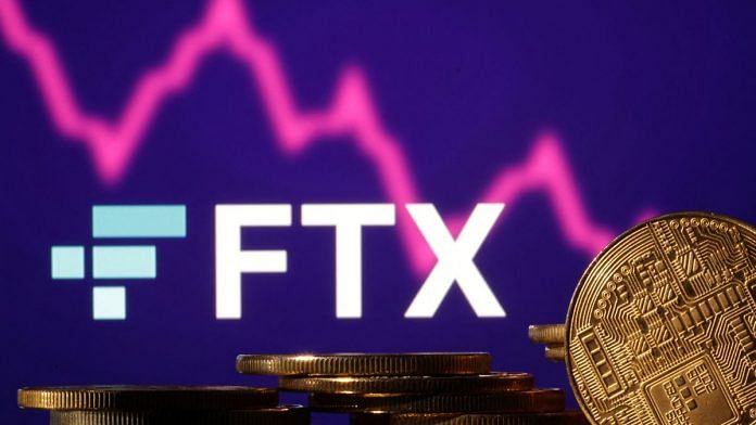 Representations of cryptocurrencies are seen in front of displayed FTX logo and decreasing stock graph in this illustration | Reuters/Dado Ruvic/Illustration