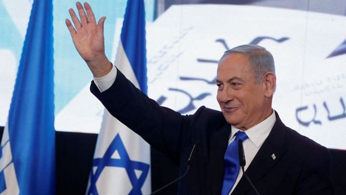 Benjamin Netanyahu waves as he addresses his supporters at his party headquarters during Israel's general election in Jerusalem on 2 November 2022 | Credit: Ammar Awad, Reuters
