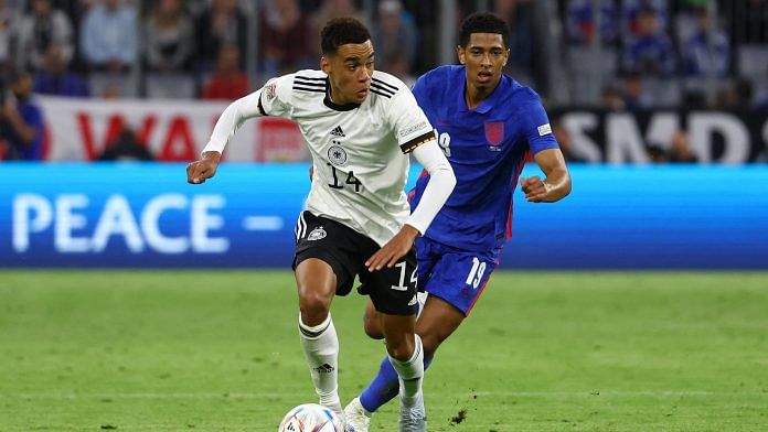 Germany's Jamal Musiala in action with England's Jude Bellingham on 7 June 2022 | Reuters