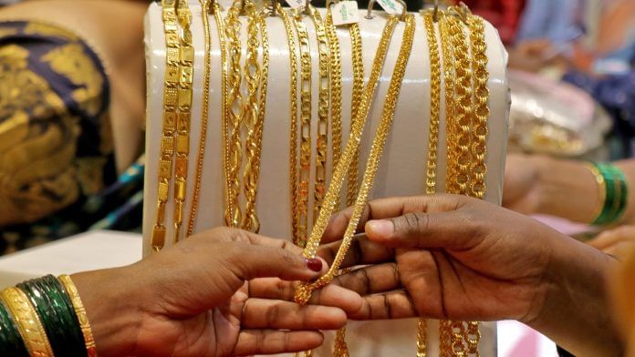 Customers check ornaments at a jewellery showroom during Dhanteras | Reuters | File Photo