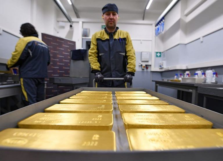 Gold firms as U.S. dollar, bond yields retreat ahead of Fed verdict