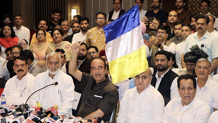 Ghulam Nabi Azad (in black) unveils the flag of his party, Democratic Azad Party, in Jammu in September | ANI