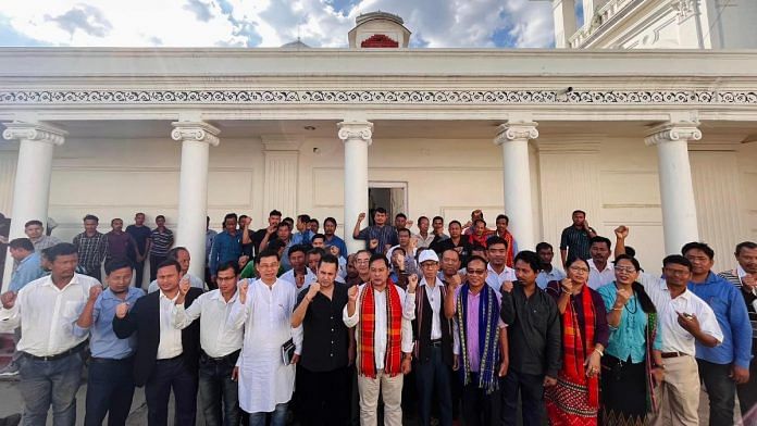 Mevar Kumar Jamatia (centre, with red scarf) with TIPRA Motha supremo Pradyot Kishore Debbarma (black shirt, right of Jamatia) after joining the party in Agartala on Wednesday | Twitter | @PradyotManikya