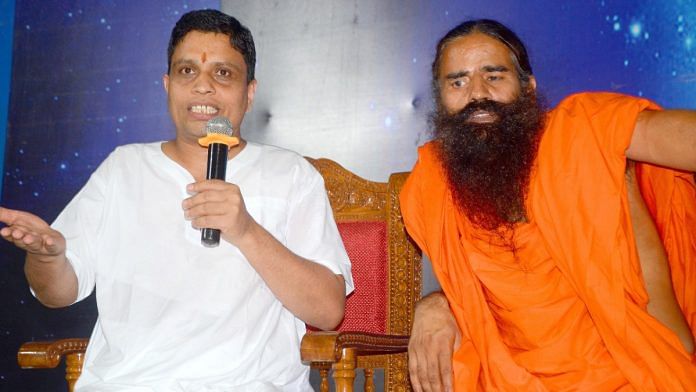 File photo of Patanjali CEO Acharya Balkrishna and yoga guru Ramdev | ANI