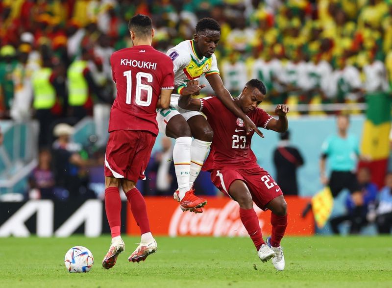 Soccer-Senegal win puts hosts Qatar on brink of World Cup elimination