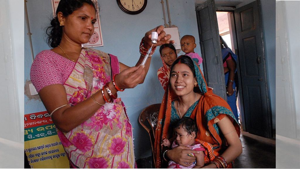 Representational image of a health worker giving vaccine to children