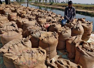 File photo of A worker packing a sack filled with rice on the outskirts of Ahmedabad 27 February, 2015 | Reuters