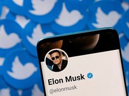 File photo of Elon Musk's Twitter profile as seen on a smartphone placed on printed Twitter logos taken pn 28 April, 2022 | Reuters