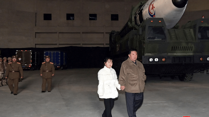North Korean leader Kim Jong Un, along with his daughter, inspects an intercontinental ballistic missile (ICBM) in this undated photo released on 19 November, 2022 by North Korea's Korean Central News Agency (KCNA). KCNA via Reuters