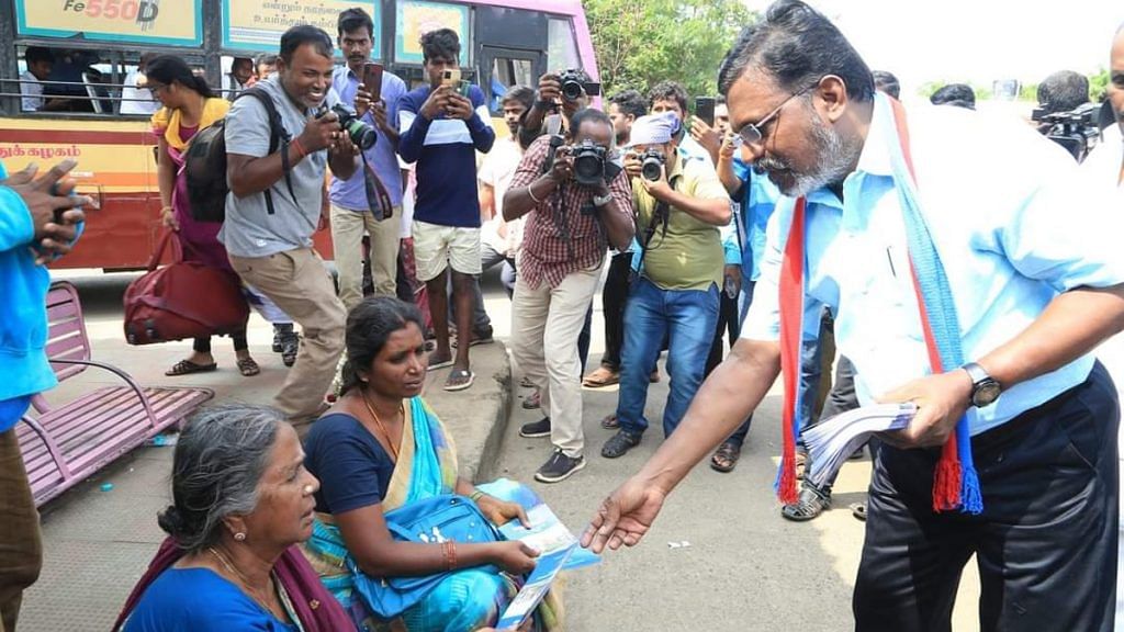 VCK founder Thol. Thirumavalavan distributes copies of Manusmriti to people on Sunday | Twitter | @thirumaofficial