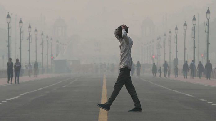 Commuters walk on Kartavya Path amid severe smog in New Delhi, on 4 November 2022 | Suraj Singh Bisht | ThePrint