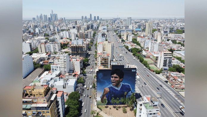 Mural depicting Argentine soccer legend Diego Armando Maradona | Reuters File Photo/Agustin Marcarian