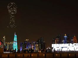 A drone show with the World Cup trophy on display is seen above the skyline of Doha, Qatar, on 15 November 2022 | Reuters