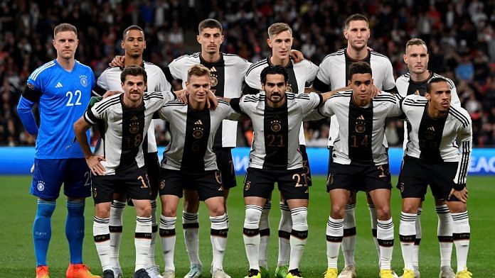 Germany players pose for a team group photo before a match against England on 26 September 2022 | Reuters