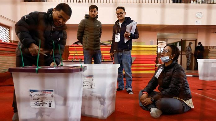 An official from the election commission breaks the seal of a ballot box before counting the votes, a day after the completion of polling, in Kathmandu, Nepal 21 November 2022 | Reuters/Navesh Chitrakar
