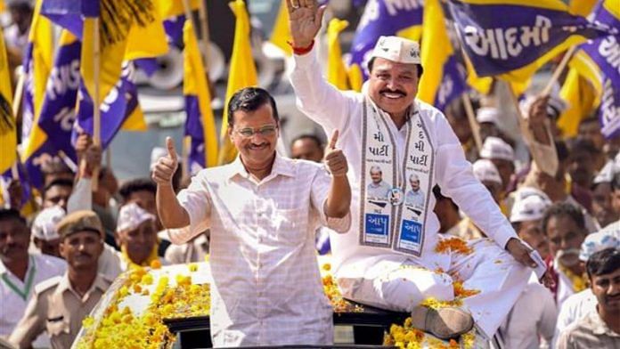 Delhi CM and AAP coordinator Arvind Kejriwal participates in a roadshow in Rajkot for the upcoming Gujarat elections | PTI