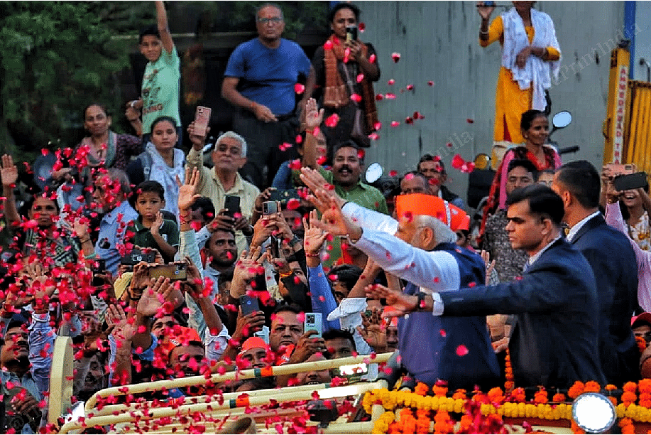 Supporters showering flower petals on PM Modi | Photo: Praveen Jain | ThePrint