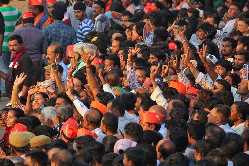 Crowd cheers as Modi's cavalcade drives past them | Photo: Praveen Jain | ThePrint