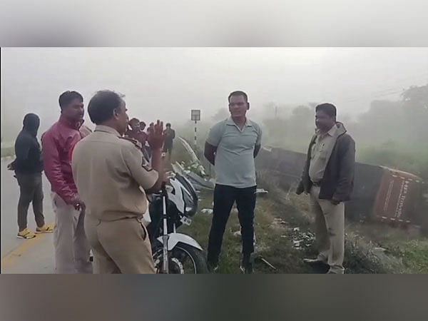 One dead, several injured after bus overturns hitting divider 