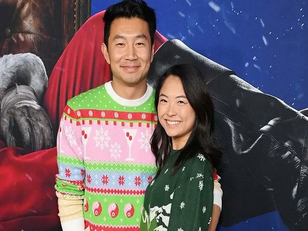 Check out this adorable picture of Simu Liu and girlfriend in colourful holiday sweaters!