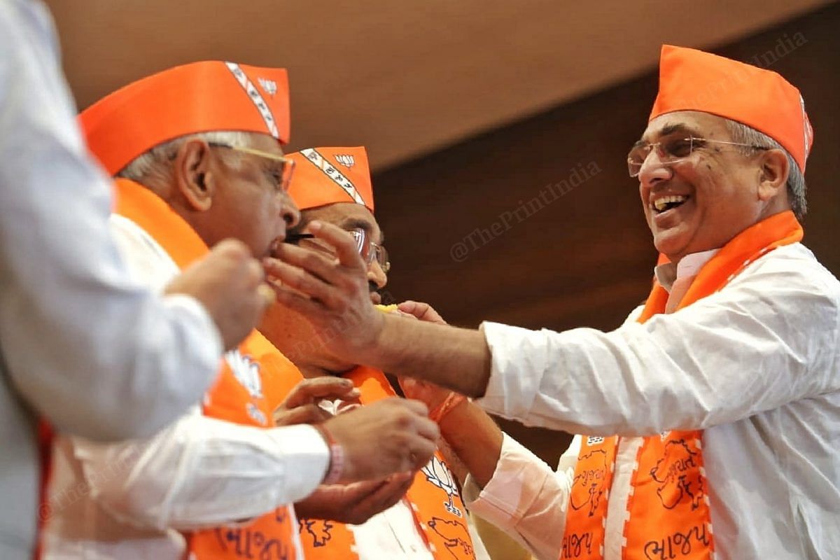 BJP leader Sudhir Gupta gives sweets to CM Patel celebrating his performance in Gujarat.  Photo: Praveen Jain |  impression