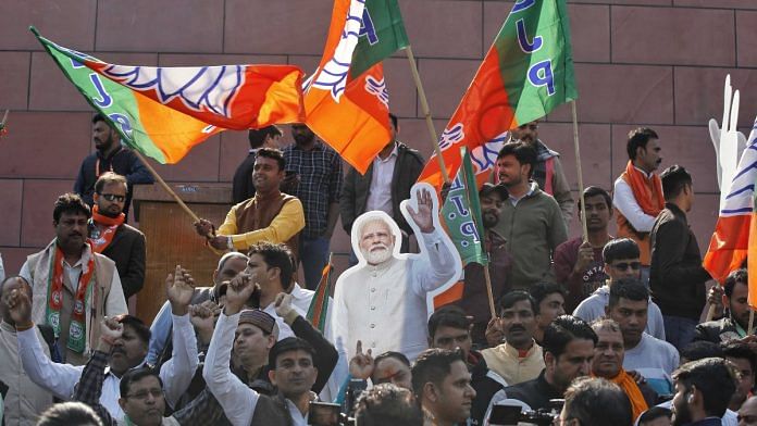 BJP supporters celebrate at the party's headquarters in New Delhi on 8 December 2022 | Suraj Singh Bisht | ThePrint