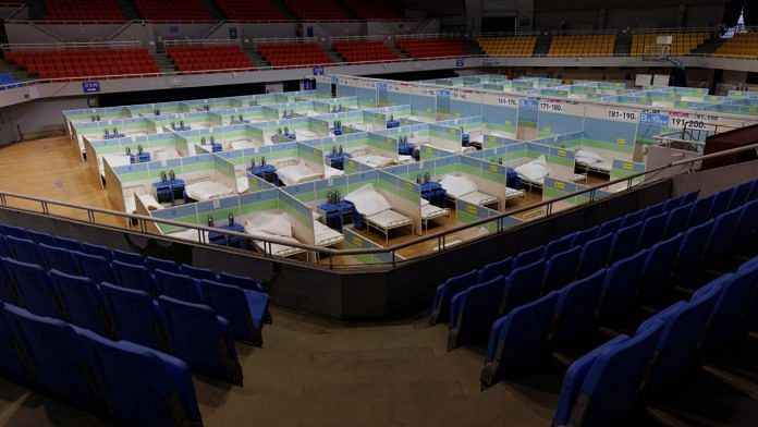 Beds are seen in a fever clinic that was set up in a sports area as coronavirus disease (COVID-19) outbreaks continue in Beijing, 20 December 2022 | Reuters/Thomas Peter