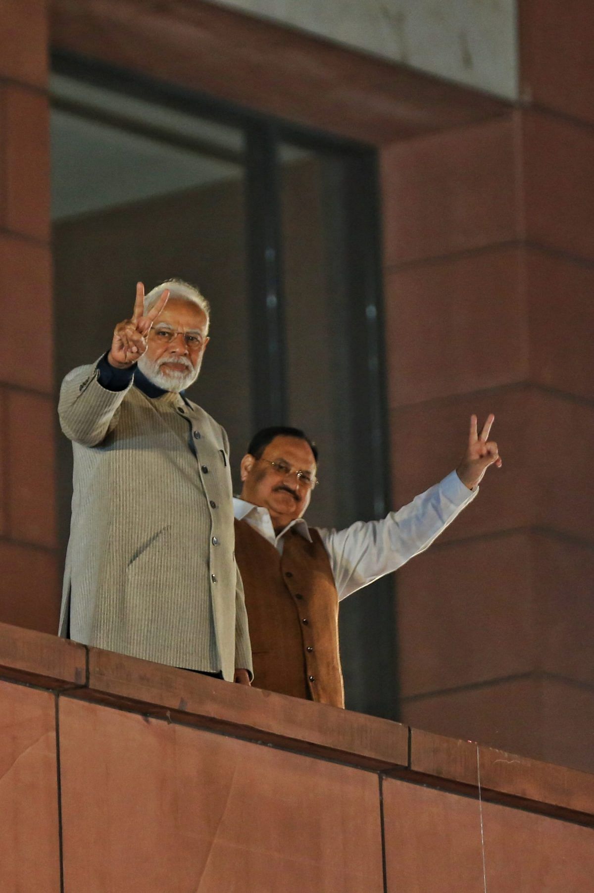 PM Modi and BJP president J.P. Nadda flash the victory sign | Photo: Suraj Singh Bisht | ThePrint