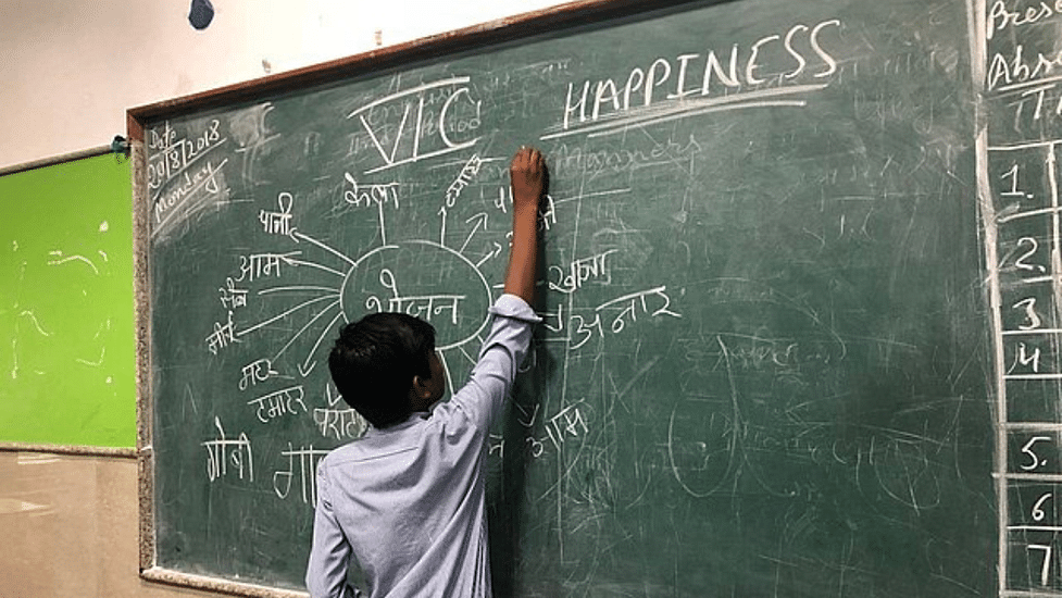 Delhi government school student defines happiness in a class | Wikimedia Commons Delhi government school student defines happiness in a class | Wikimedia Commons