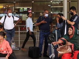 Passengers wait with their luggage at the Chhatrapati Shivaji Maharaj International Airport in Mumbai, India| Reuters/Francis Mascarenhas